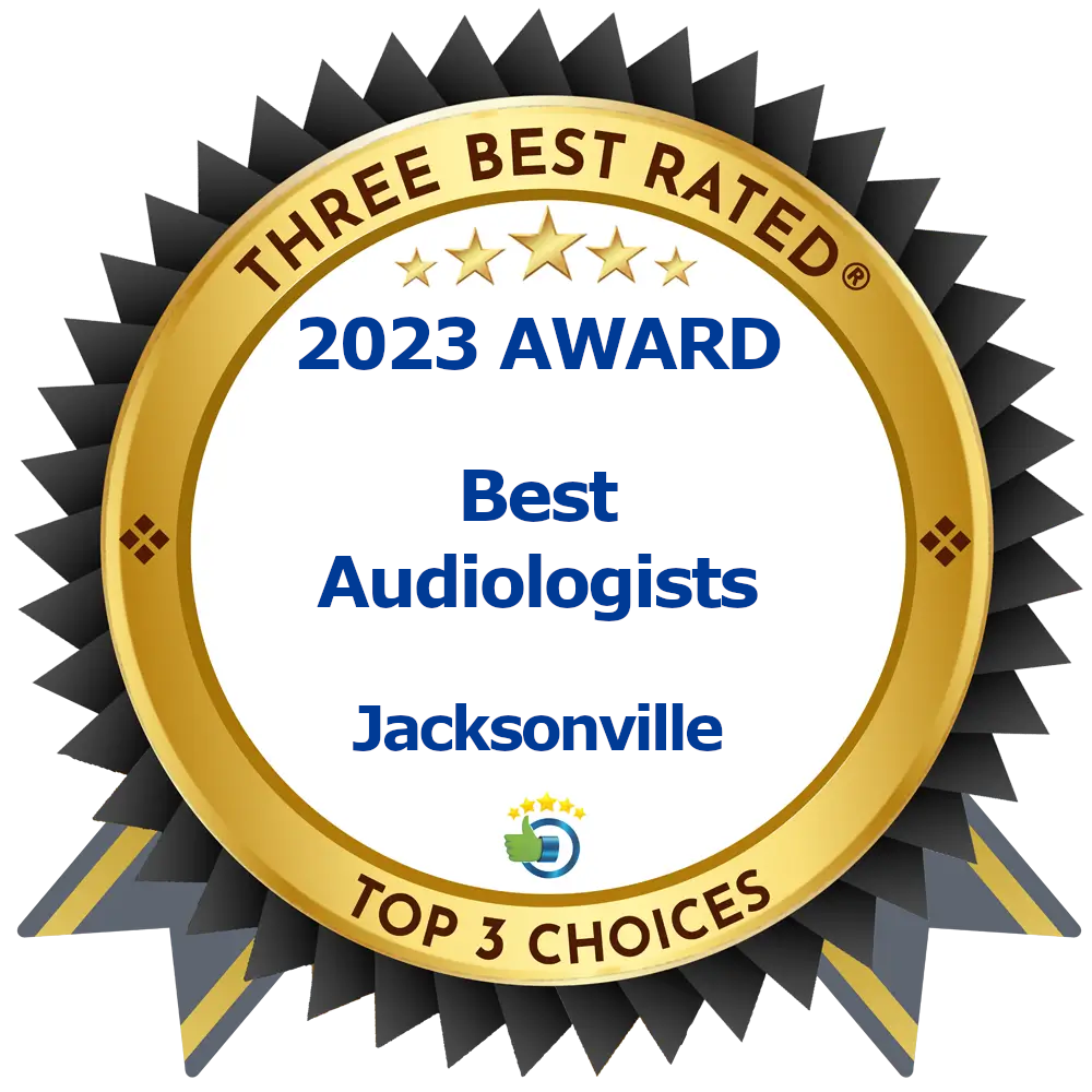 A gold and black badge reads THREE BEST RATED 2023 AWARD Best Audiologists Jacksonville TOP 3 CHOICES with a small blue and green logo at the bottom.